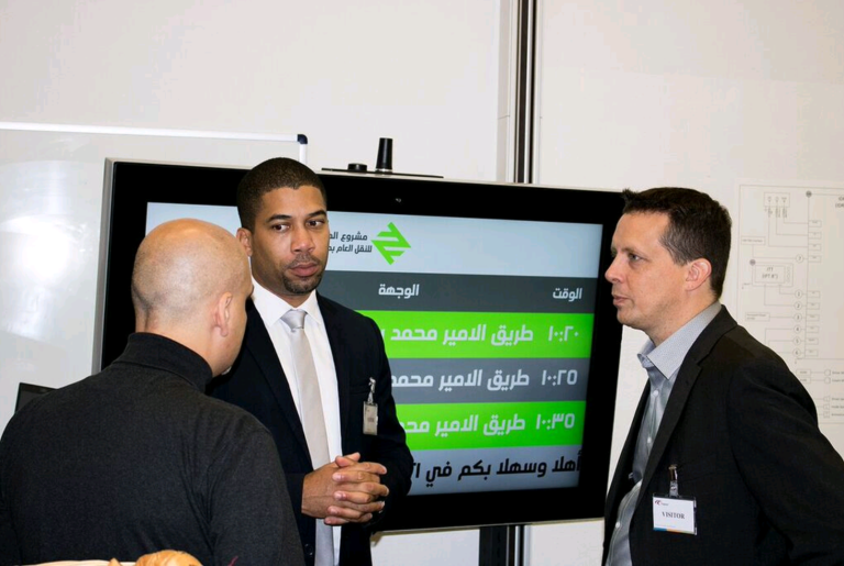 Fred and his colleagues discussing upcoming projects. 
