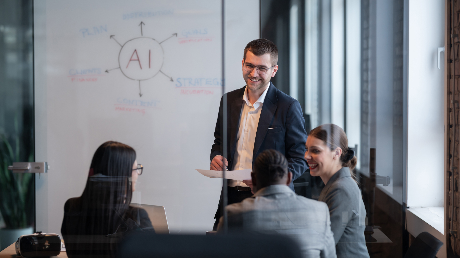 a team of four - one man and three women - discussing about AI - AI powered resource management tool